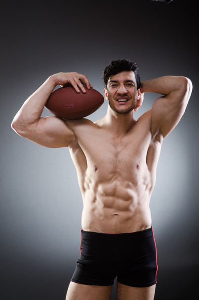 アメリカン フットボールと筋肉の男 - 写真・画像
