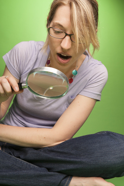 Woman with Magnifying Glass in Awe - Photo, Image
