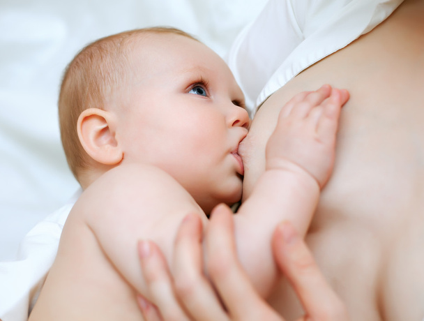 Little baby girl breast feeding - 写真・画像