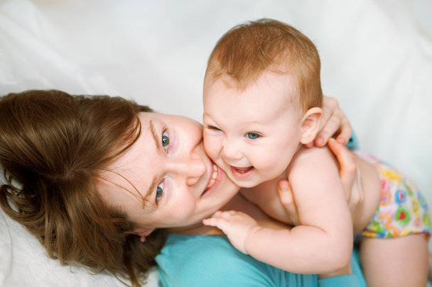 Portrait of cheerful mother and baby girl - 写真・画像