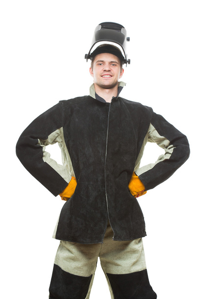 beautiful welder with arms on waist. isolated white background. - 写真・画像