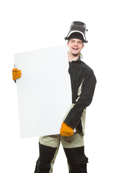 handsome welder holding a blank form. isolated on white background - Foto, Bild