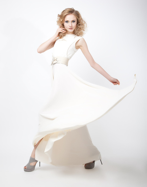 Attractive beautiful young blond hair girl in white dress - Valokuva, kuva