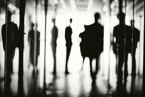 Silhouettes of several office workers - Foto, Bild