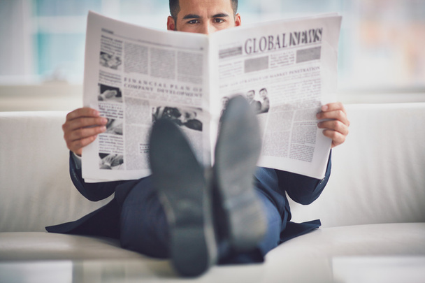 Serious businessman reading newspaper - Photo, Image