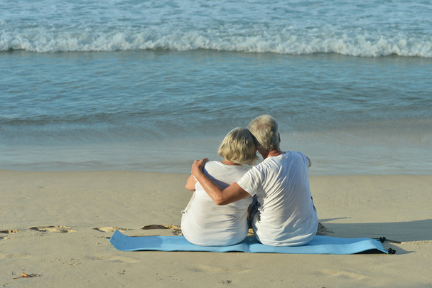 elderly couple rest at tropical resort - Фото, изображение