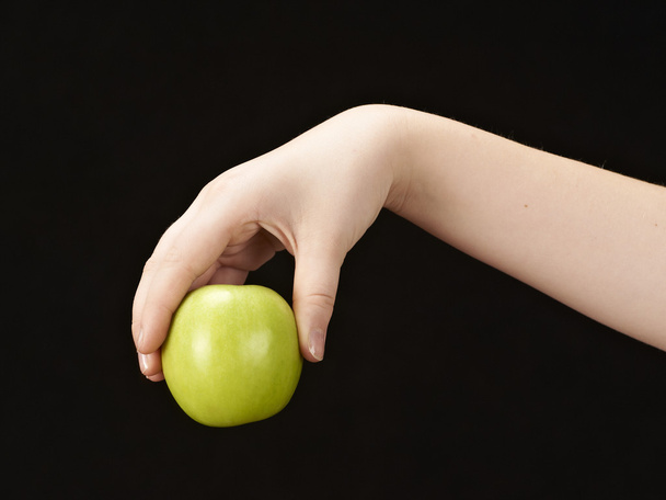 Mano de niño con manzana
 - Foto, Imagen