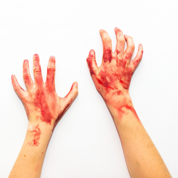 Women's bloody hands on a white background to the topic of Halloween - Foto, imagen
