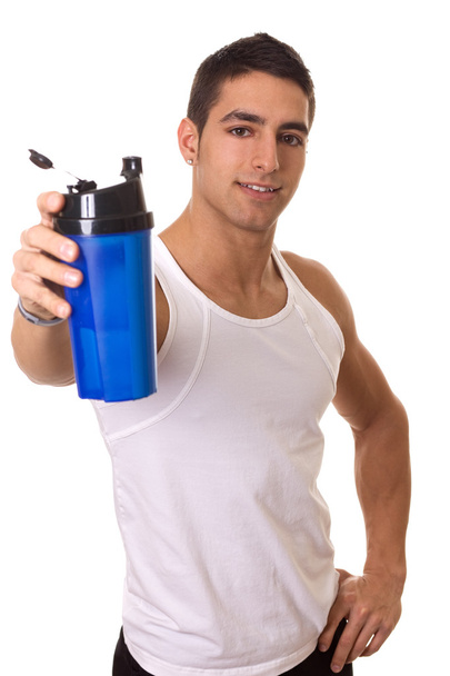 Athletic man with water bottle. Focus on face. Studio shot over white. - Photo, image
