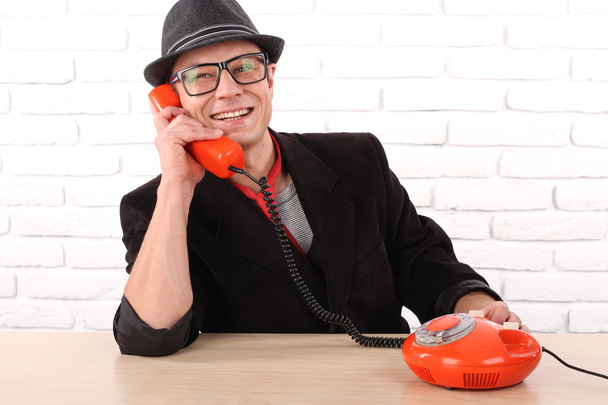 Young man talking on a vintage telephone, nice emotion - Photo, Image