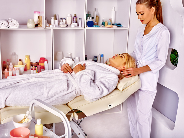 Woman middle-aged lying in spa salon with beautician. - Photo, Image