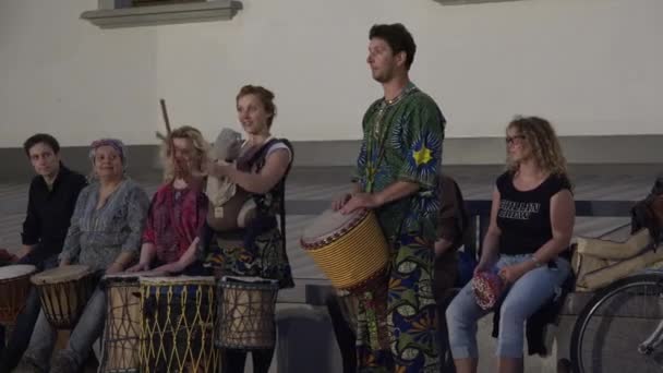 musicians group play african drums instrument in street music festival. 4K - Footage, Video