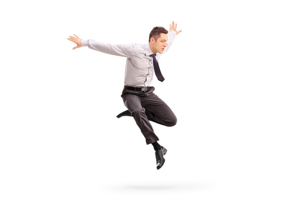 Young businessman jumping in the air - Photo, image