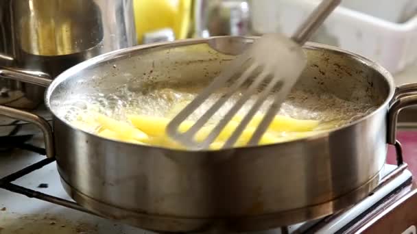 French fries cooking in boiling oil - Footage, Video
