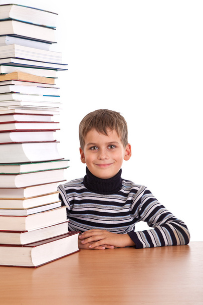 Schoolboy and a heap of books - Zdjęcie, obraz