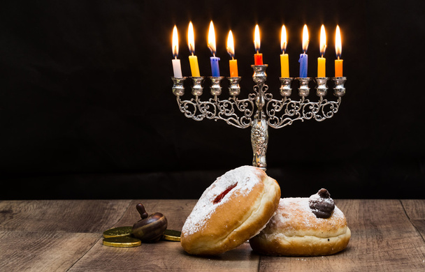 Donuts and a menorah for Hanukkah - Photo, Image