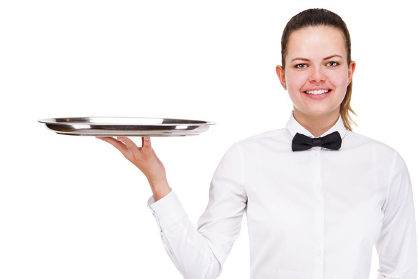 Young woman in waiter uniform holding tray isolated over white b - Fotó, kép