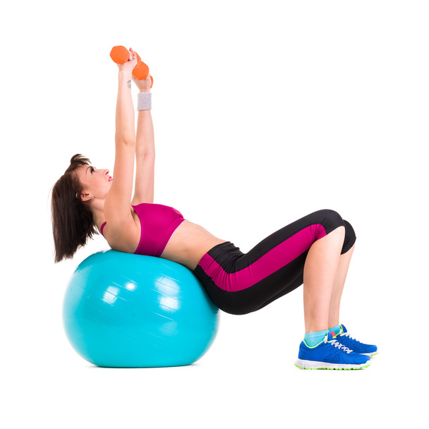 Young smiling woman makes exercise with fitball, full length portrait isolated over white - Φωτογραφία, εικόνα