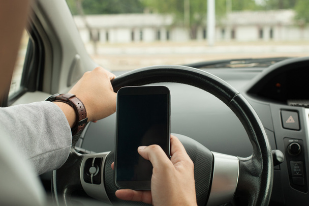 Driving with smart phone - Фото, зображення