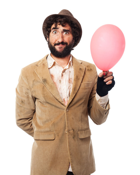 confused homeless man with balloon - Foto, Bild