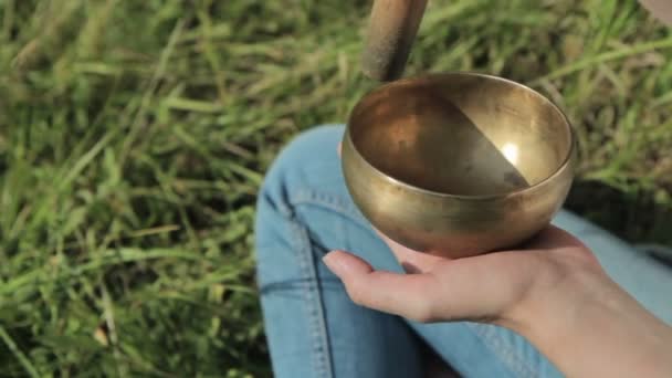 Young beautiful lady relaxing with nepal singing bowl - Footage, Video