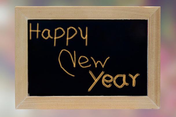 happy new year wood photo frame on pink blurred background - Zdjęcie, obraz