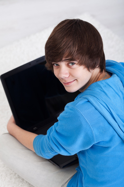 Young teenager with laptop - Fotó, kép