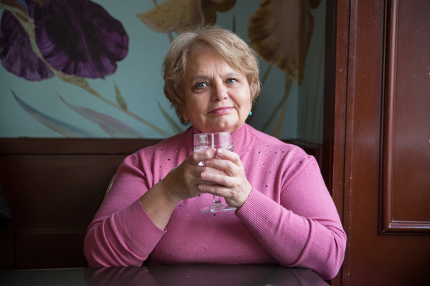 Pensioner Russian woman in cafe - Photo, Image
