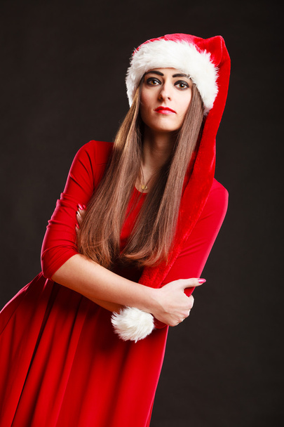 woman wearing santa claus hat on black - Photo, Image