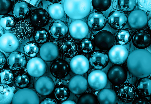 Background of colored Christmas tree balls and decorations cyan style filtered - Fotó, kép