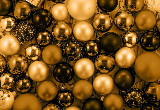 Background of colored Christmas tree balls and decorations yellow style filtered - Photo, Image