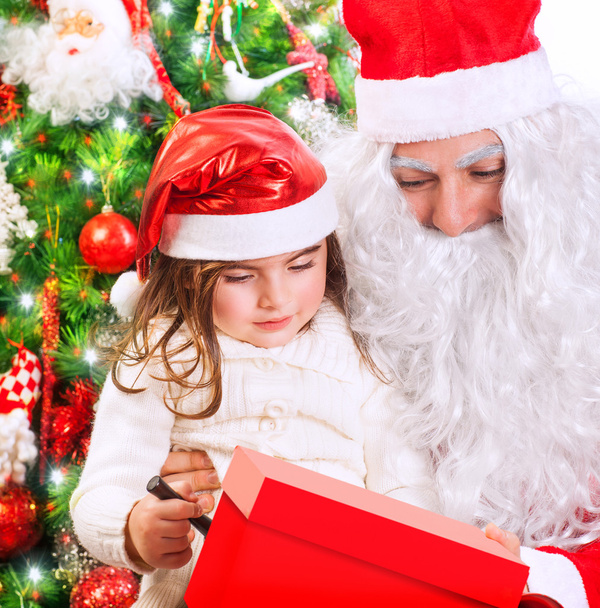 Little girl with Santa Claus - Fotó, kép