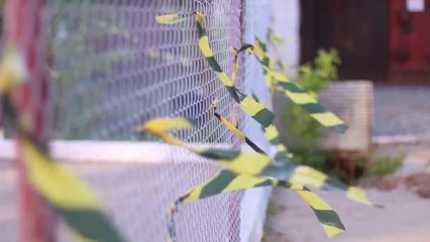 Metal net with waving ribbons outdoor at summer day - Filmmaterial, Video