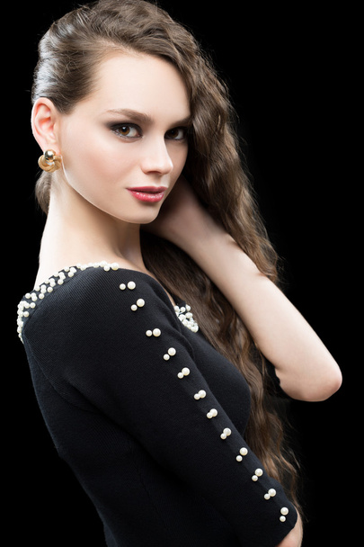 Portrait of beautiful brunette woman in black dress. - Zdjęcie, obraz