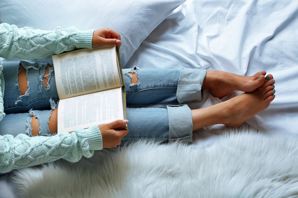Woman in jeans on bed  - Фото, зображення