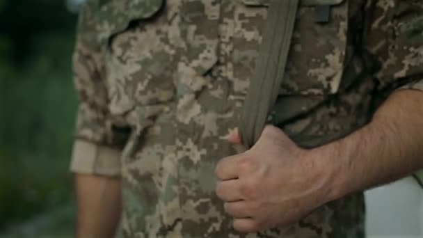 certain military man walk on the sandy road - Materiał filmowy, wideo