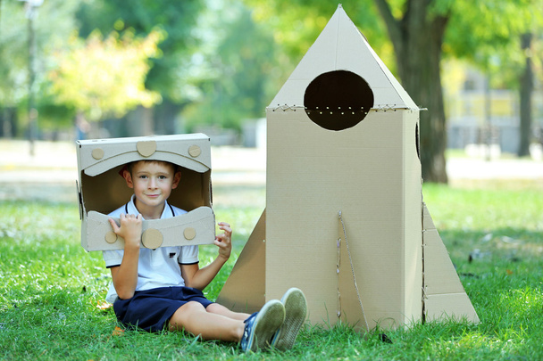 Funny boy in carton helmet  - Φωτογραφία, εικόνα