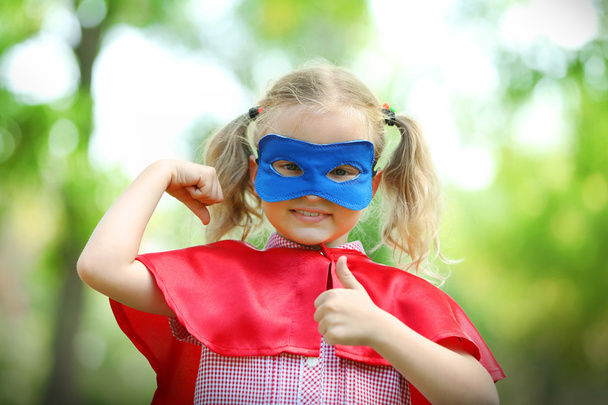 Superhero little girl at the park - Photo, Image