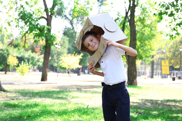 Funny boy in carton helmet  - Fotoğraf, Görsel