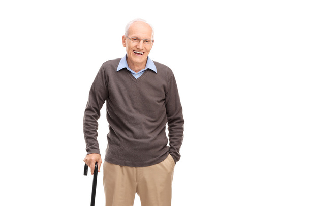 Senior man with a cane smiling - Fotoğraf, Görsel