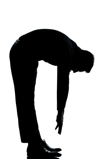 Silhouette man stretching back full length - Fotó, kép