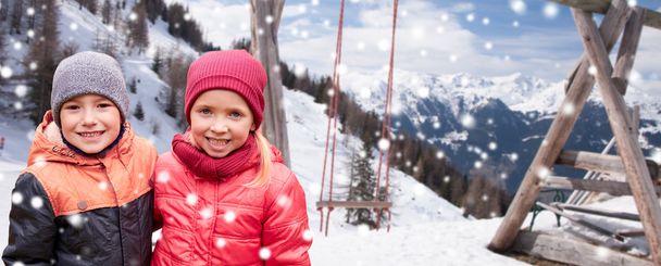 happy little girl and boy over winter - Fotó, kép