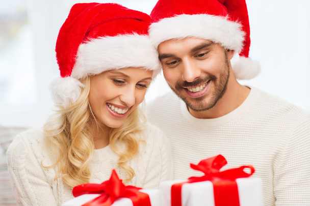 happy couple at home with christmas gift boxes - Fotografie, Obrázek