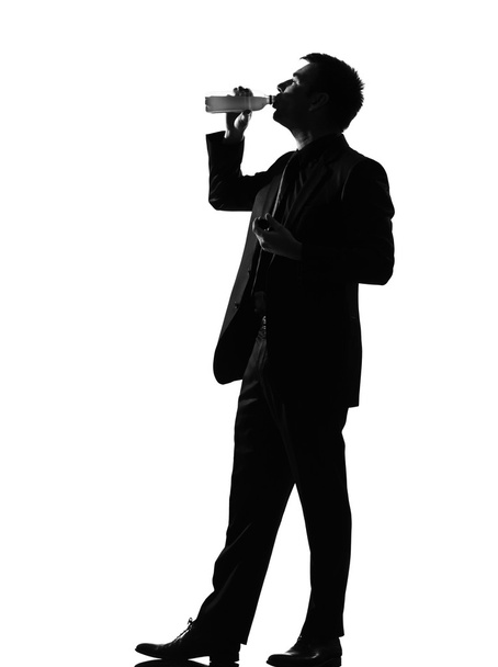 Silhouette man drinking - Фото, изображение