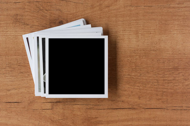 Polaroid photo frames on wooden background - Foto, Imagem