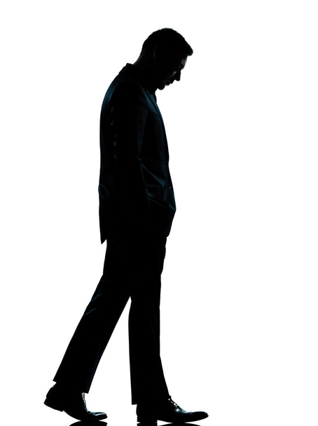 One business man walking looking down silhouette - Photo, Image