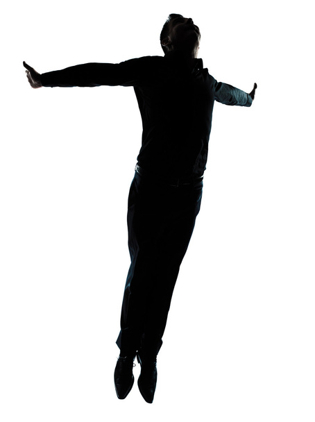 One business man jumping flying wellness silhouette - Фото, изображение
