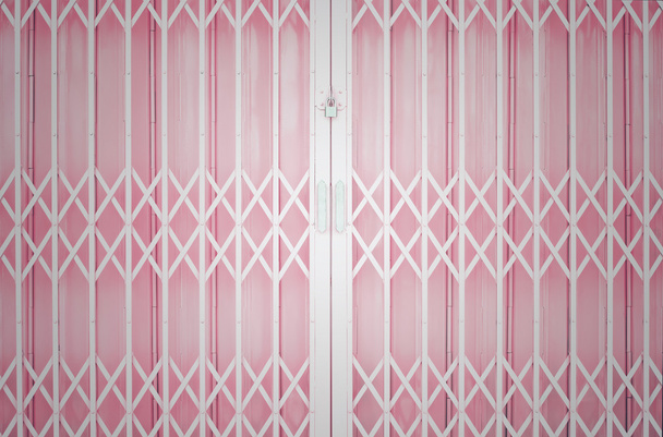 Pink metal grille sliding door with pad lock and aluminium handl - Photo, Image
