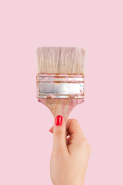 Female hand holding Paintbrush isolated. - Fotó, kép