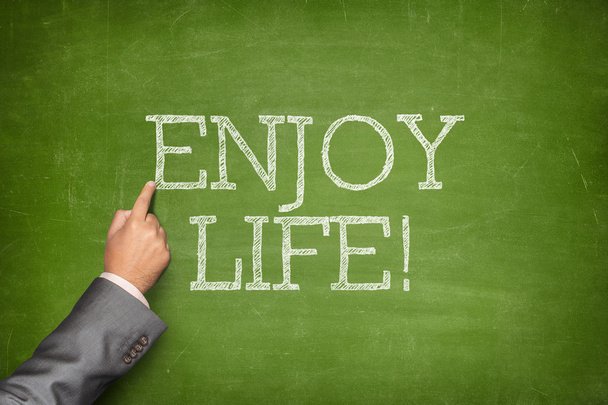 Enjoy life text on blackboard - Photo, image